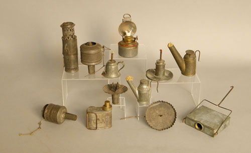 Appraisal: Group of tin lighting devices th c to include peg