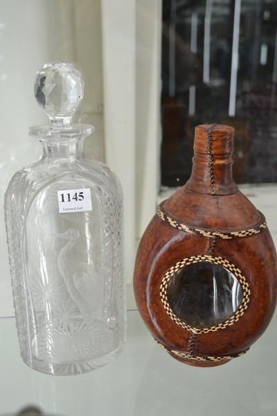 Appraisal: ETCHED DECANTER WITH FLAMINGO SCENE AND AN AFRICAN LEATHER COVERED