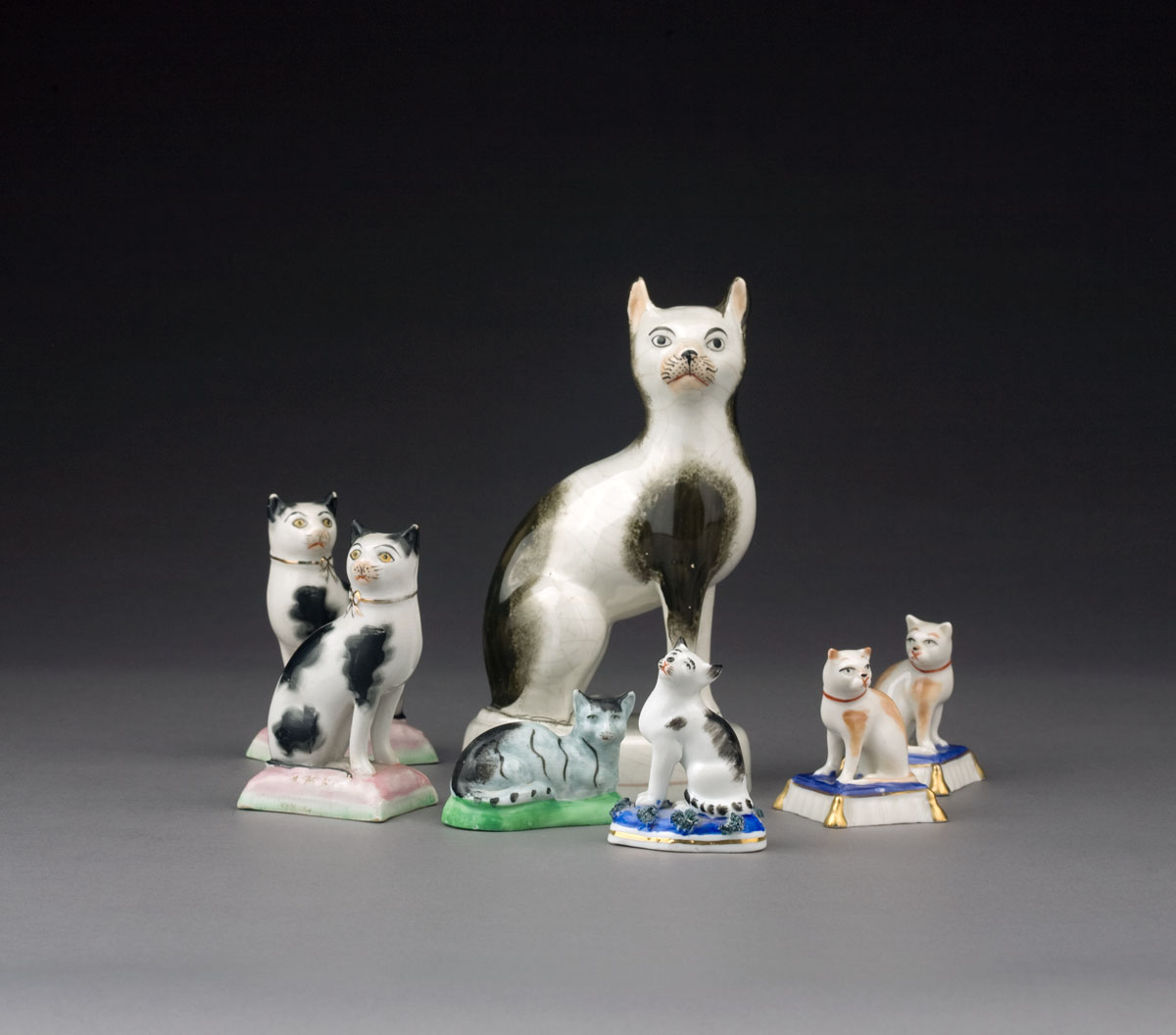 Appraisal: GROUP OF STAFFORDSHIRE POTTERY AND PORCELAIN FIGURES OF CATS NINETEENTH-TWENTIETH