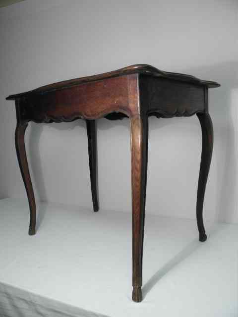 Appraisal: A French carved wood side table with cabriole style legs