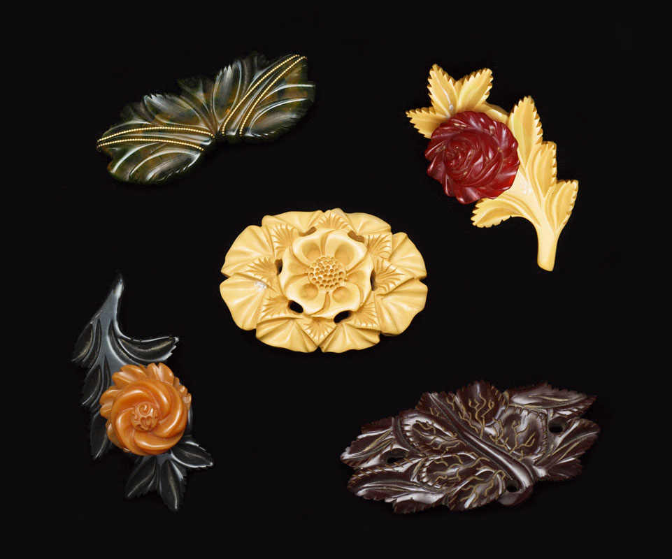 Appraisal: CARVED BAKELITE PINS Flower and leaf motifs '' - ''