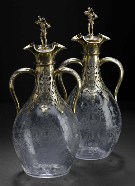 Appraisal: A pair of Victorian silver-gilt mounted glass decanters George Fox