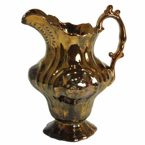 Appraisal: An English Victorian Copper Lustre Pitcher circa modeled with a