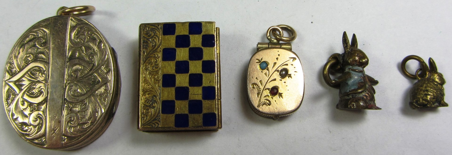 Appraisal: A blue enameled rectangular locket formed as two books an