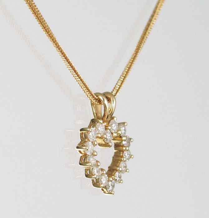 Appraisal: K GOLD DIAMOND PENDANT ON A k GOLD CHAIN K