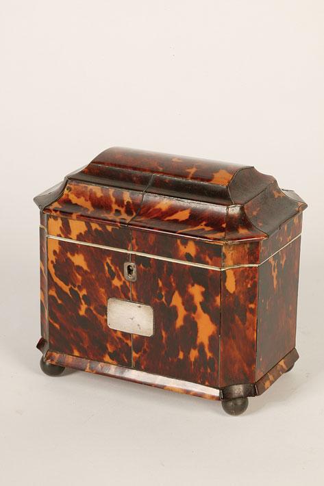 Appraisal: A REGENCY TORTOISESHELL VENEERED TEA CADDY the rising lid with