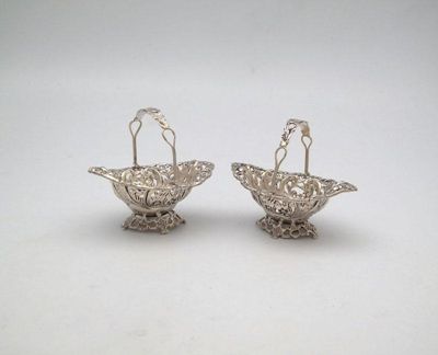 Appraisal: A pair of Victorian silver bonbon baskets by H Matthews