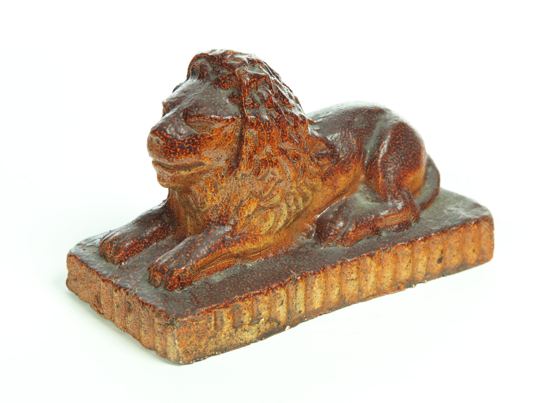 Appraisal: SEWERTILE LION Ohio early th century Reclining lion on a