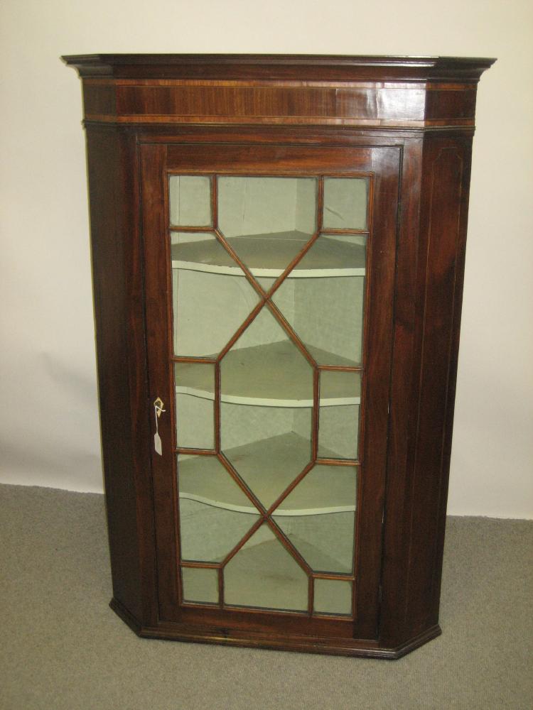 Appraisal: A GEORGE III GLAZED MAHOGANY CORNER CUPBOARD late th century