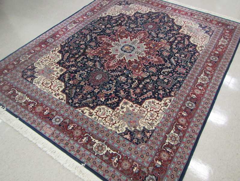 Appraisal: HAND KNOTTED ORIENTAL CARPET Indo-Persian stylized floral and central floral