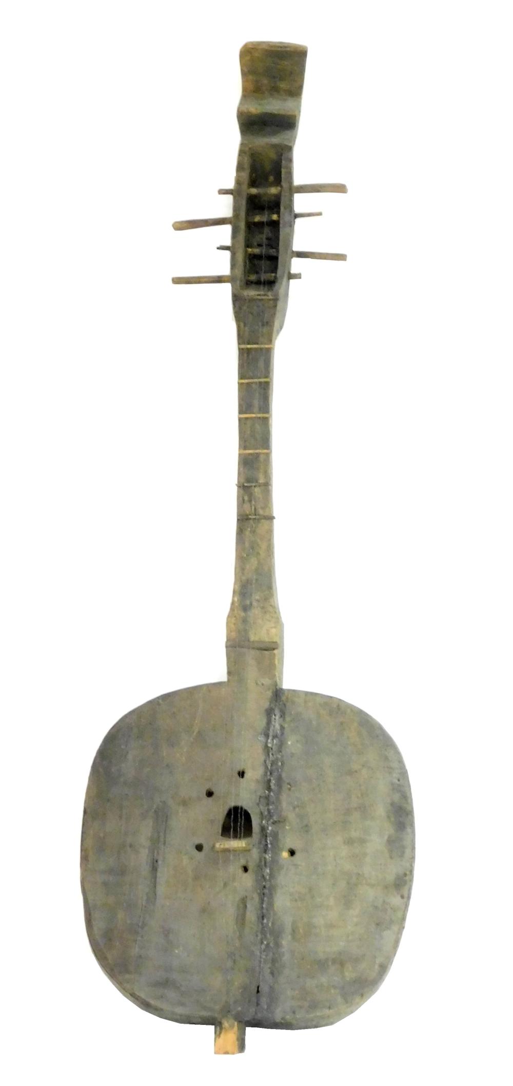 Appraisal: TRIBAL African musical string instrument carved wood dark patina hollow