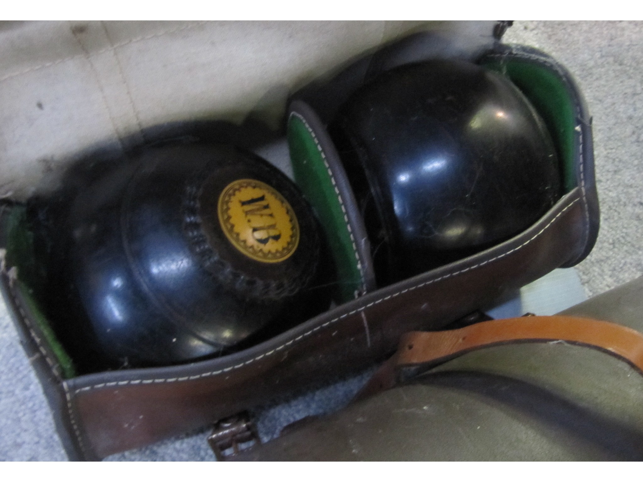 Appraisal: A lot comprising a set of four lawn bowls in