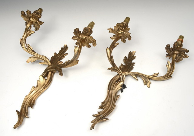 Appraisal: A PAIR OF FRENCH ROCOCO STYLE GILT BRASS TWO BRANCH