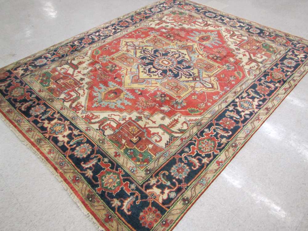 Appraisal: HAND KNOTTED ORIENTAL CARPET Persian Serapi design in a distinct