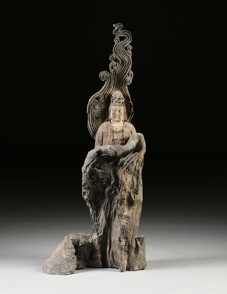 Appraisal: A LARGE CHINESE CARVED TREE TRUNK BUST OF GUANYIN TH