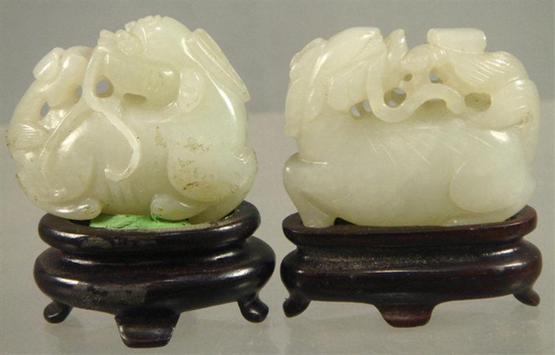 Appraisal: Lot of th c Chinese similarly carved jade amulets both