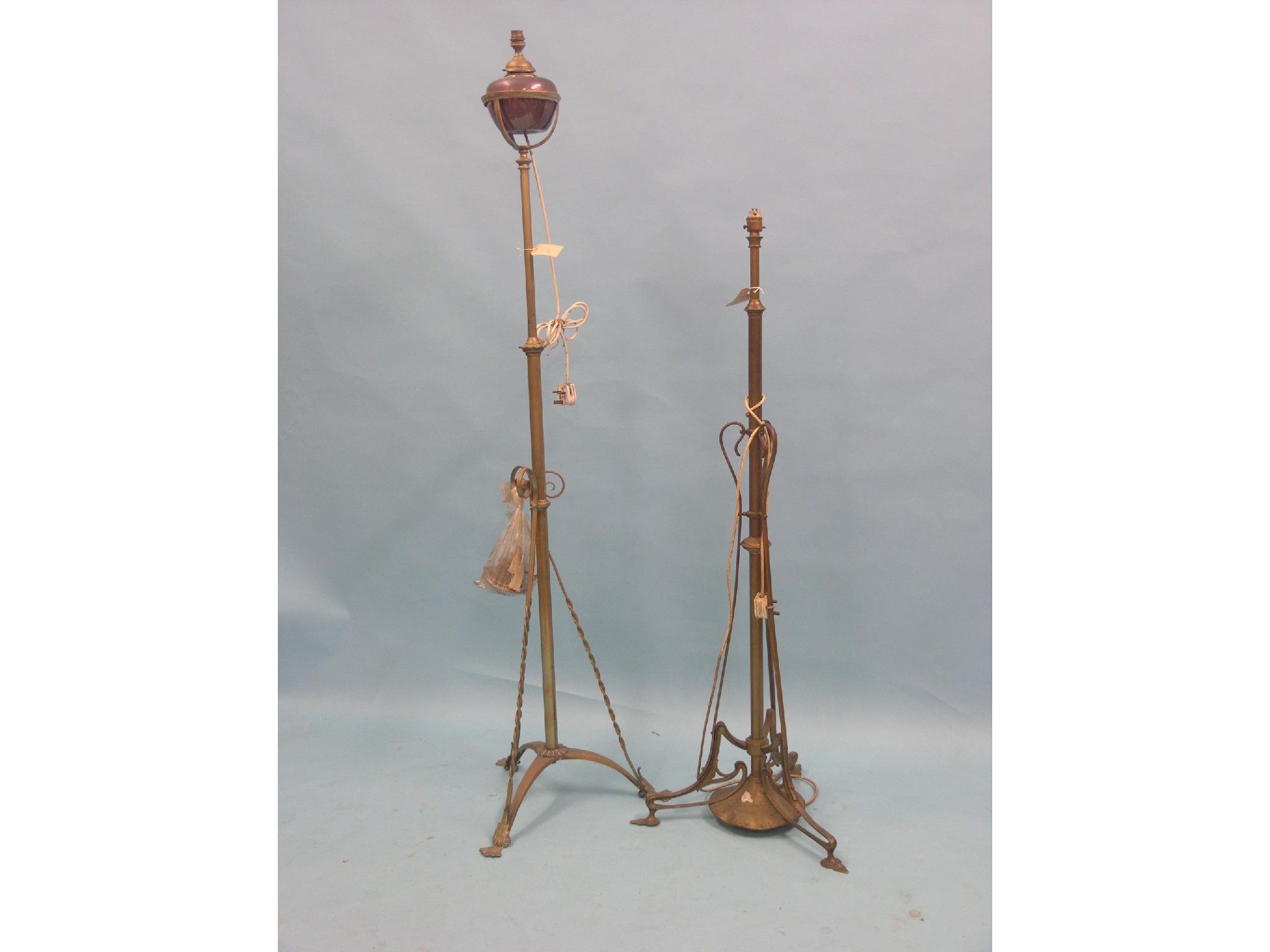 Appraisal: Two early th century brass floor lamps one with telescopic