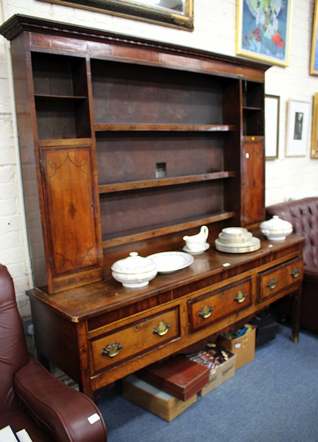 Appraisal: A GEORGE III OAK DRESSER the boarded shelf back with