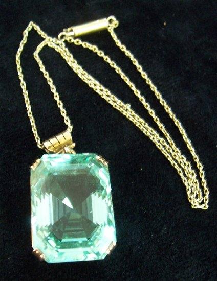 Appraisal: A large single stone aquamarine pendant the rectangular cut stone