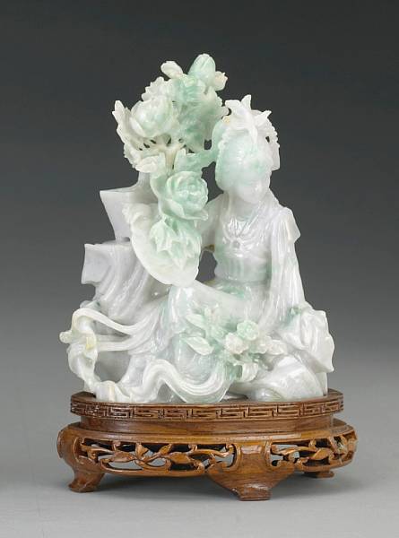 Appraisal: A pale green jadeite seated beauty th Century The maiden