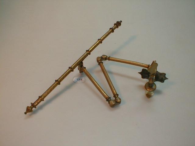 Appraisal: A thC brass fire screen bracket with folding arm and