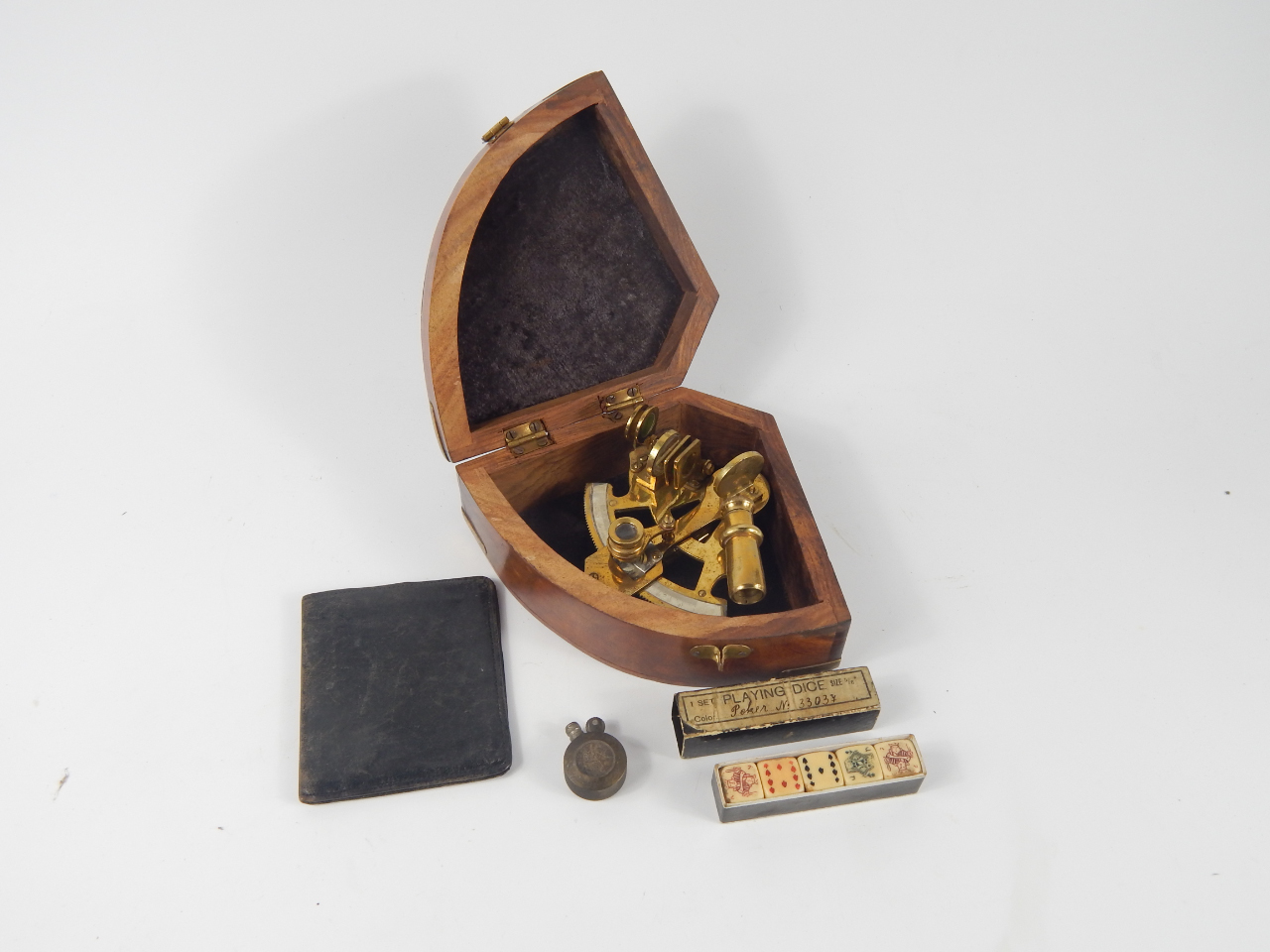 Appraisal: A brass sextant cased trench art pocket lighter wallet and