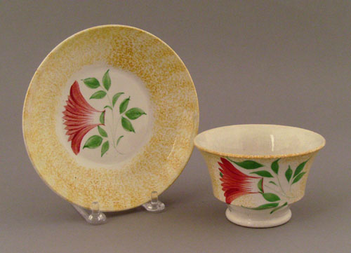 Appraisal: Yellow spatter cup and saucer th c with thistle