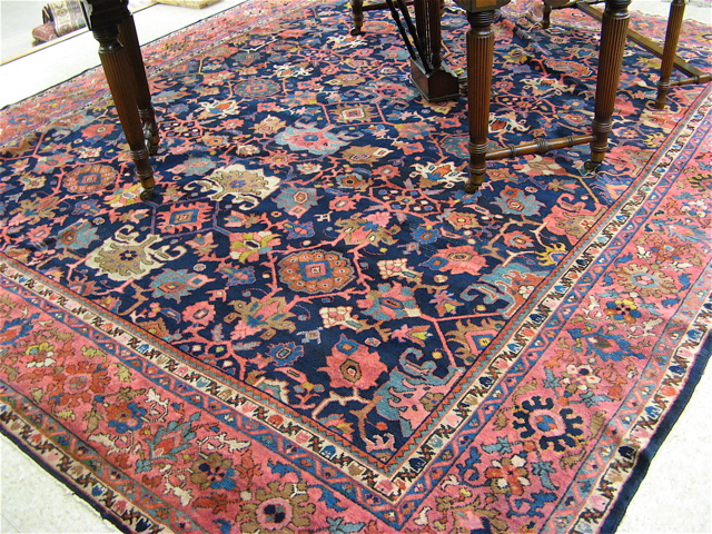 Appraisal: SEMI-ANTIQUE PERSIAN CARPET hand knotted in a geometric and stylized