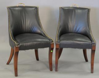 Appraisal: Pair of leather upholstered chairs Pair of leather upholstered chairs