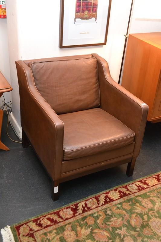 Appraisal: A DANISH BROWN LEATHER ARMCHAIR A DANISH BROWN LEATHER ARMCHAIR