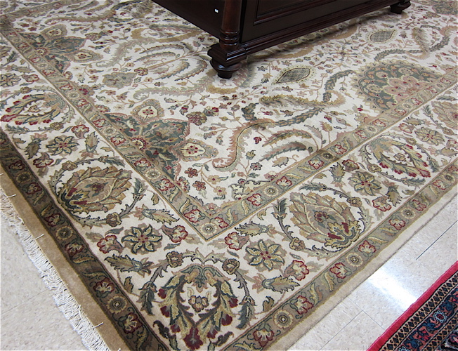 Appraisal: HAND KNOTTED ORIENTAL CARPET Indo-Persian floral and central floral medallion