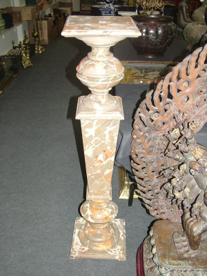 Appraisal: A wooden faux marble pedestal with stepped square base and