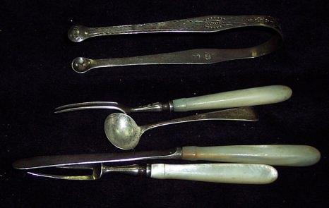 Appraisal: A pair of Georgian cut sugar tongs a salt spoon