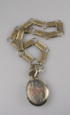 Appraisal: Large silver hinged locket having chinoiserie-style bird on front suspended