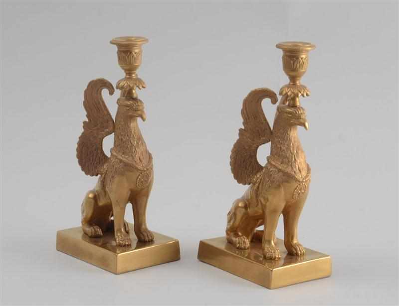 Appraisal: PAIR OF SWEDISH NEOCLASSICAL GILT COMPOSITION EAGLE-FORM CANDLESTICKS Each modeled