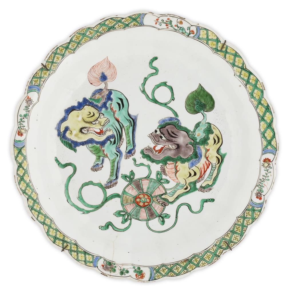 Appraisal: FAMILLE VERTE 'BUDDHIST LION' DISH KANGXI PERIOD with scalloped rim