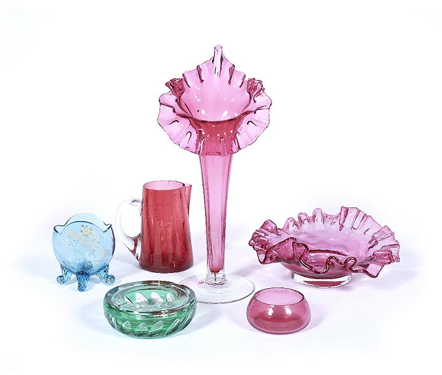 Appraisal: A collection of coloured glass th Centuryincluding a cranberry epergne