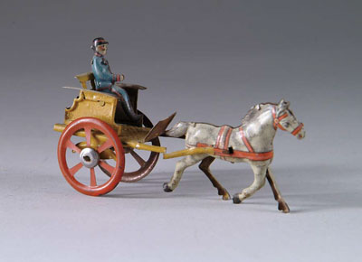 Appraisal: HORSE DRAWN PENNY TOY All tin lithographed toy shows trotting