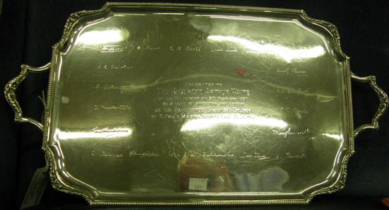 Appraisal: A SHAPED OBLONG SILVER TWO HANDLED TRAY with presentation inscription