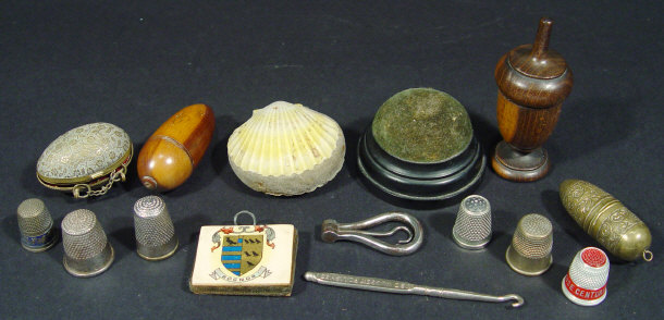 Appraisal: Collection of sewing items including a wooden and chased metal