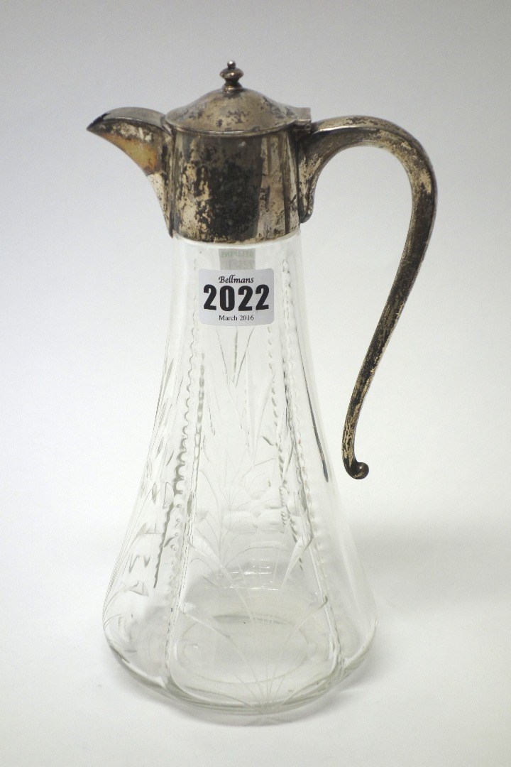 Appraisal: A silver mounted glass claret jug of tapering form with