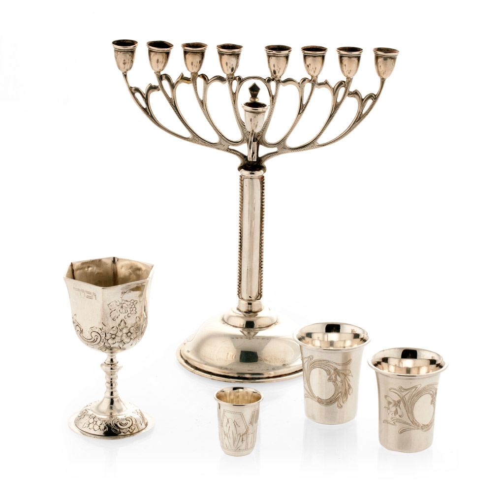 Appraisal: A menorah standard of traditional form slight beaded detail to