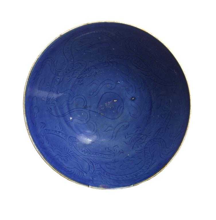 Appraisal: A CHINESE BLUE GLAZED BISCUIT PORCELAIN BOWL of widely flared