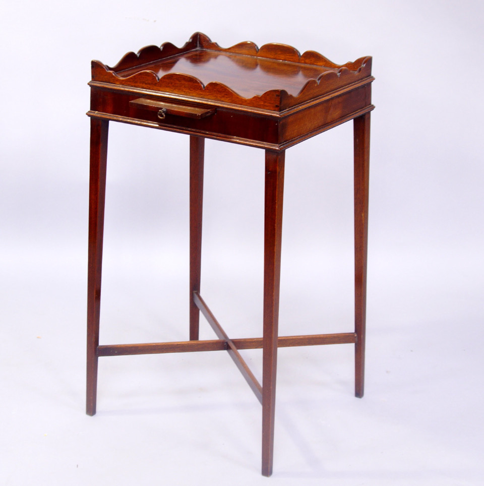 Appraisal: A George III style mahogany urn stand with fretwork gallery