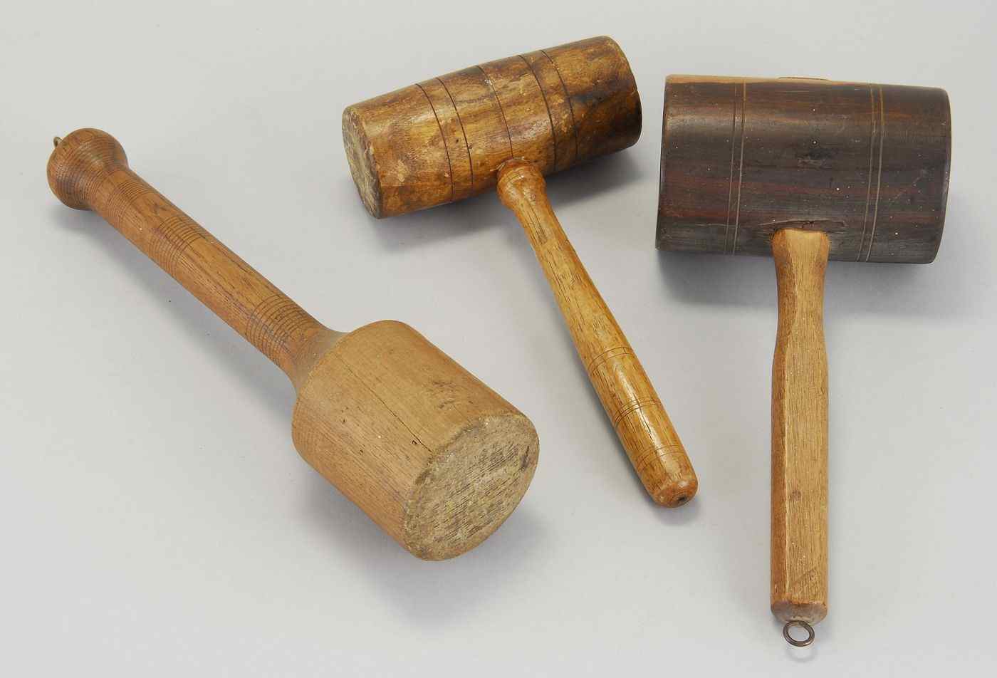 Appraisal: THREE WOODEN MALLETS th CenturyOne in lignum vitae Lengths from