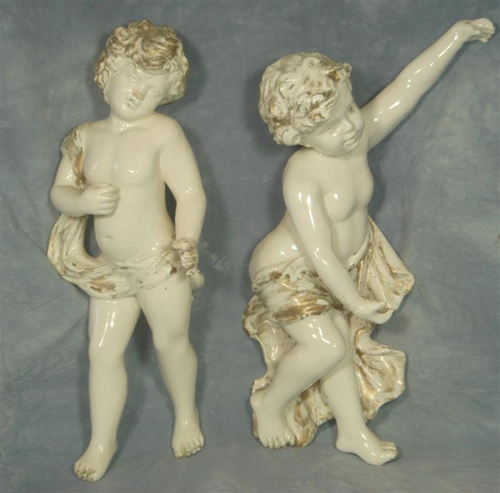 Appraisal: Pair of white porcelain cherubs wall decorations h Estimate -