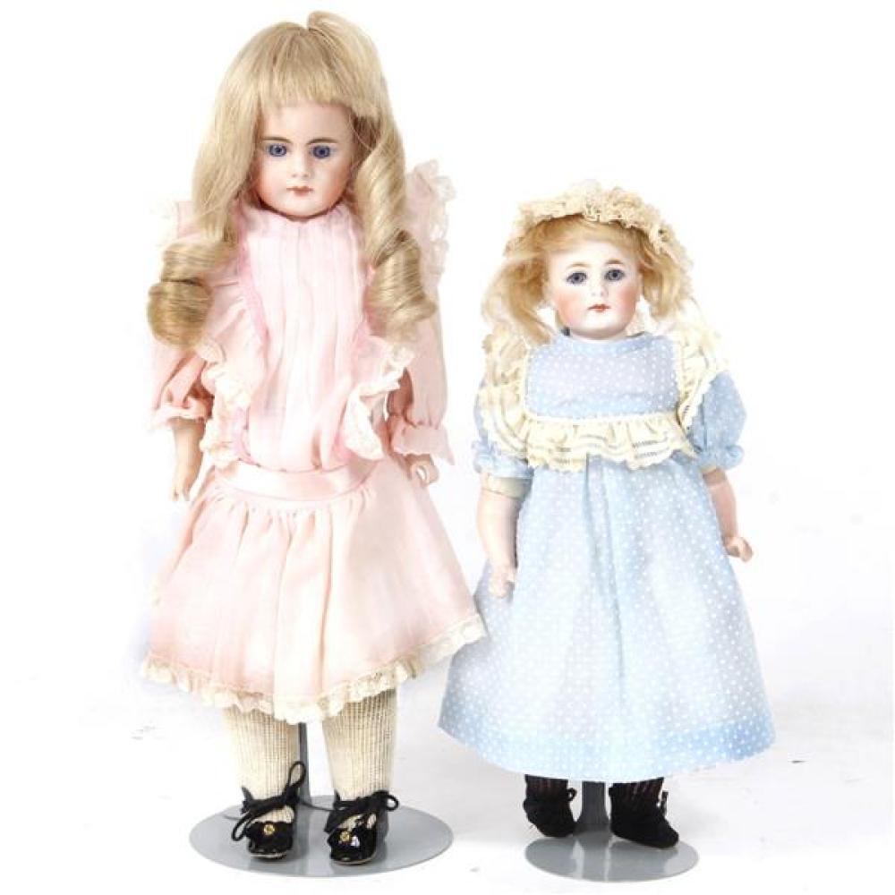 Appraisal: TWO GERMAN BISQUE SHOULDER HEAD DOLLS WITH CLOSED MOUTH PIERCED