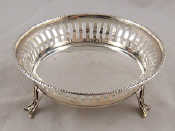 Appraisal: A sterling silver open dish on three pierced feet with