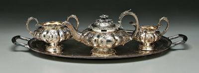 Appraisal: English silver tea service rounded melon form bodies C-scroll handles