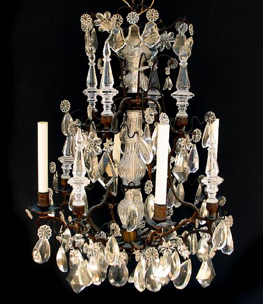 Appraisal: A patinated metal and cut glass chandelier height in width